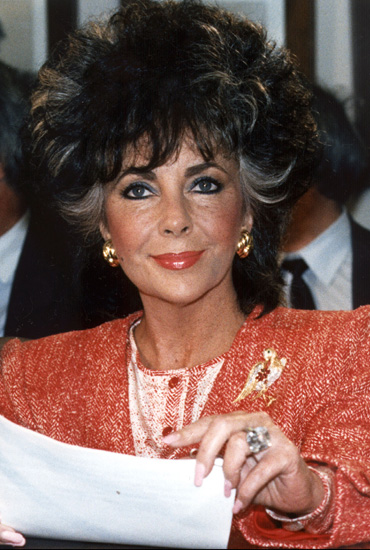 Movie star Elizabeth Taylor smiles as she appears