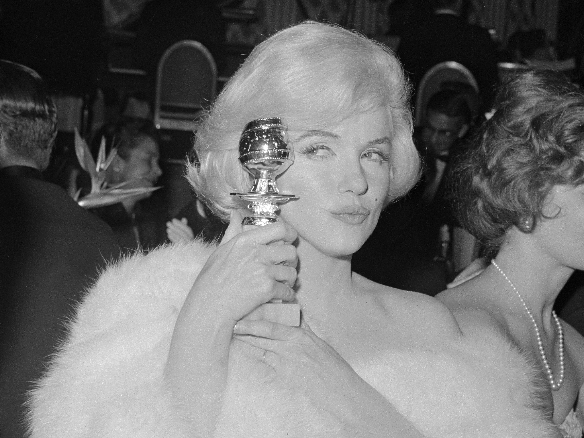 Marilyn Monroe and her first Golden Globe, 1960