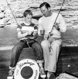 US Actor Errol Flynn pays attention as he is given