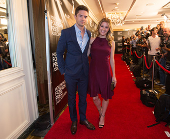 Beverly Hills, CA. August 13, 2015 Hollywood Foreign Press Association presents annual Grants Dinner Thursday night from the Beverly Wilshire Hotel.  The HFPA will present more than $2 million in donations to non-profit entertainment-related organizations and scholarship programs.  Pictured:  Topher Grace and Ashley Hinshaw arrive on the red carpet.