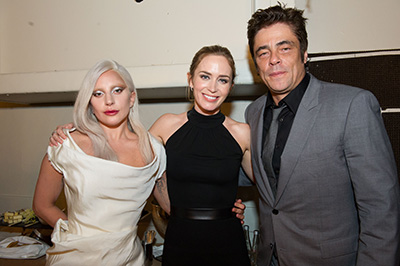 Beverly Hills, CA. August 13, 2015 Hollywood Foreign Press Association presents annual Grants Dinner Thursday night from the Beverly Wilshire Hotel.  The HFPA will present more than $2 million in donations to non-profit entertainment-related organizations and scholarship programs.  Pictured: Lady Gaga accepts for the Music Center / Young Musicians Foundation with Emily Blunt and John Krasinsky.