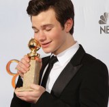 Actor Chris Colfer poses with his award
