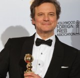 Actor Colin Firth poses with his award f