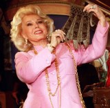 Actress Zsa Zsa Gabor,(L), holds up a beaded purse