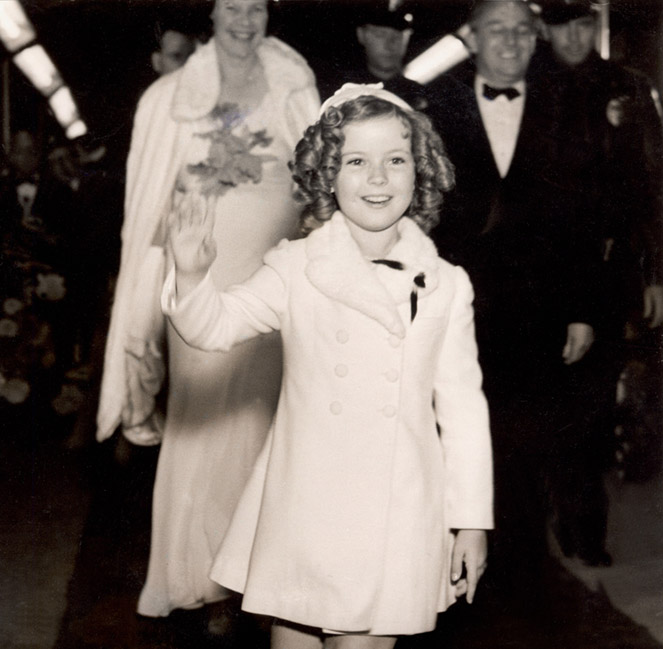 Child film star Shirley Temple (1928- ) arrives at