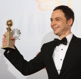 Actor Jim Parsons poses with his award f