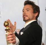 Actor Robert Downey Jr. poses with his a