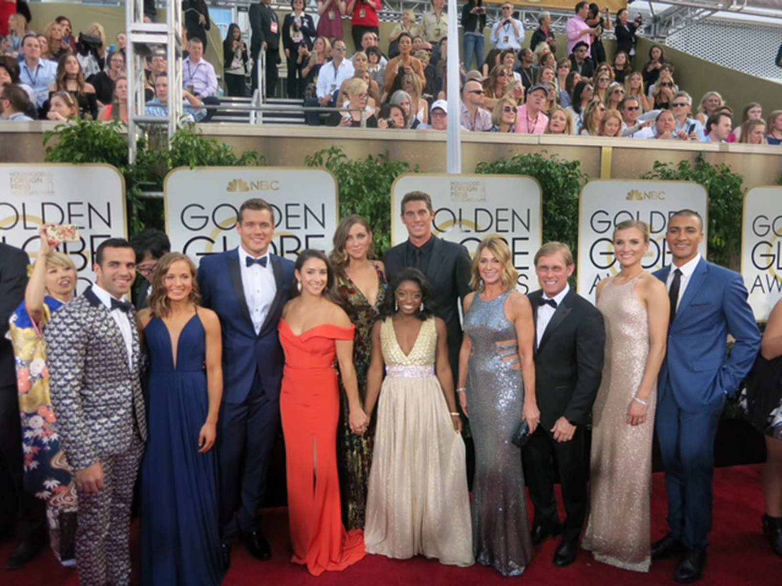 Olympic Champions Danell J. Leyva, Madison Kocian, Football Player Colton Underwood, Olympic Champions Aly Raisman, Guest, Conor Dwyer, Simone Biles, Nadia Comaneci, Bart Conner, Brianne Theisen-Eaton and Ashton Eaton at the Golden Globes (2017).