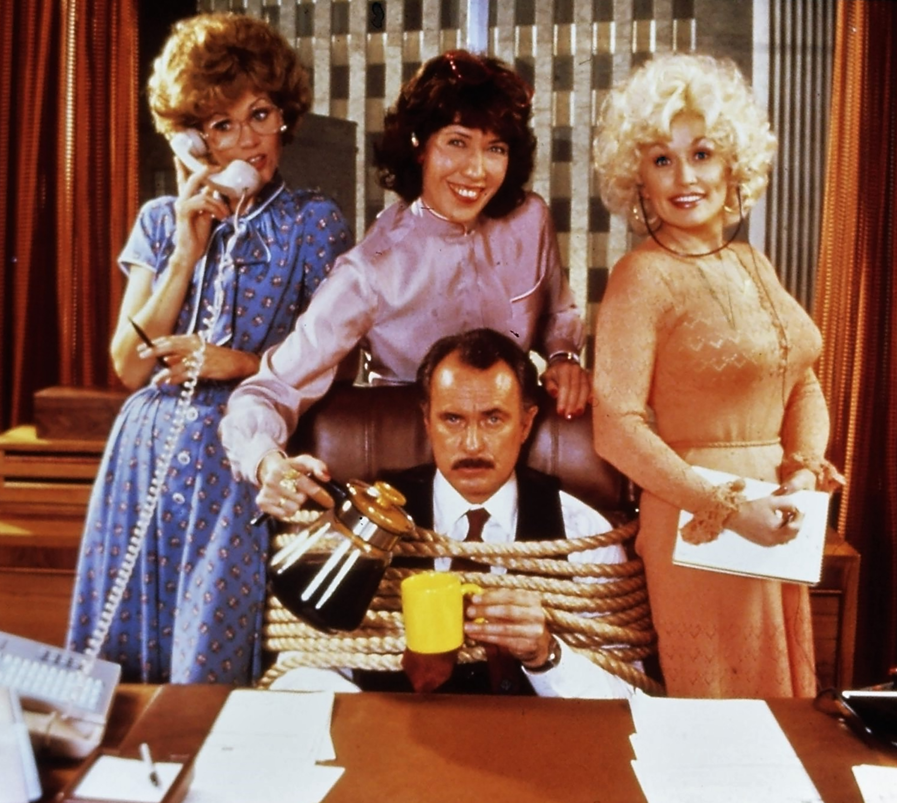 Jane Fonda, Dolly Parton, Dabney Coleman, and Lily Tomlin in “9 to 5” (1980)