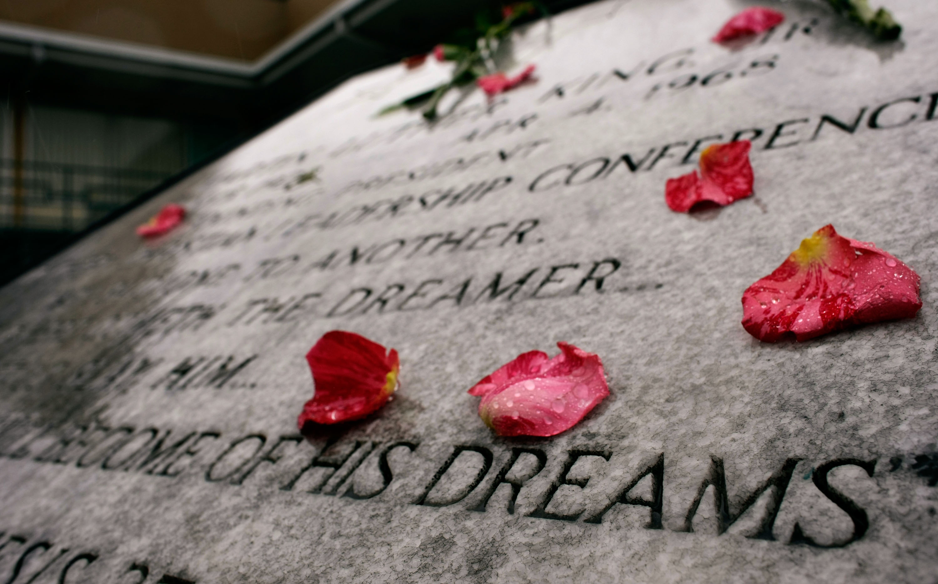  A commemorative plaque honoring Martin Luther King Jr. is covered with flowers outside the Lorraine Hotel, the site where Martin Luther King Jr was assassinated, April 4, 2008 in Memphis, Tennessee