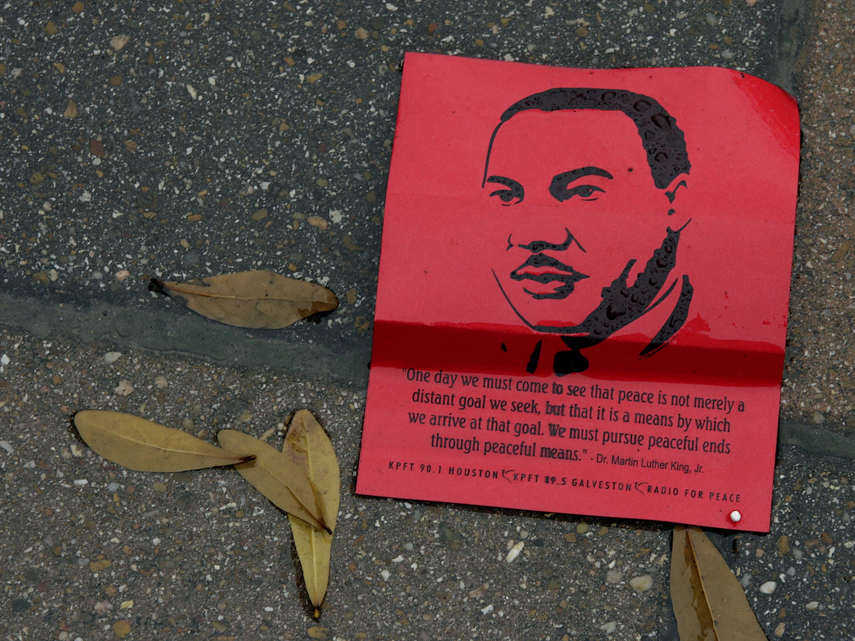  A flier bearing the likeness of Martin Luther King Jr. lies in the rain following the MLK Grande Parade January 15, 2007 in Houston, Texas