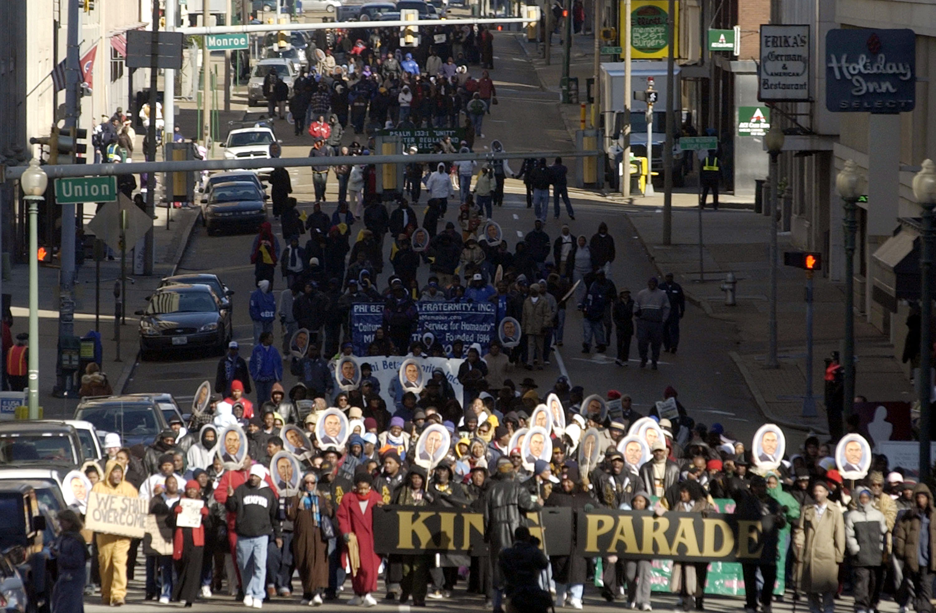 Marchers walk in a parade honoring the legacy of Dr. Martin Luther King, Jr. on January 17, 2005 in Memphis, Tenessee