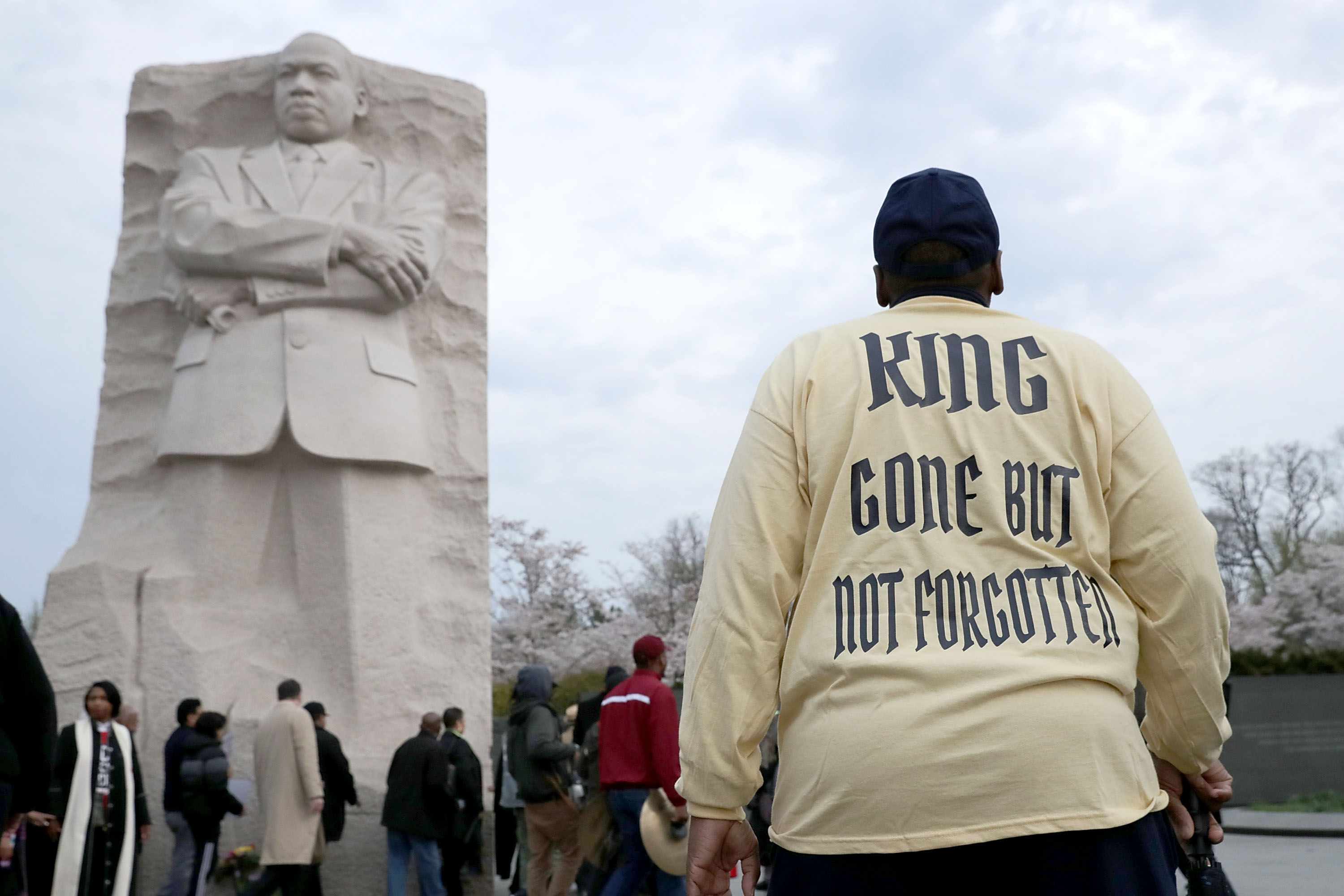 Marchers gather at the Dr. Martin Luther King Jr. Memorial for a silent walk to a prayer service on the National Mall to mark the 50th anniversary of King