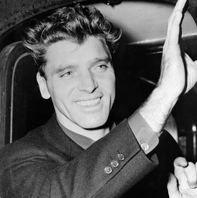 US actor Burt Lancaster waves to wellwishers 08 De