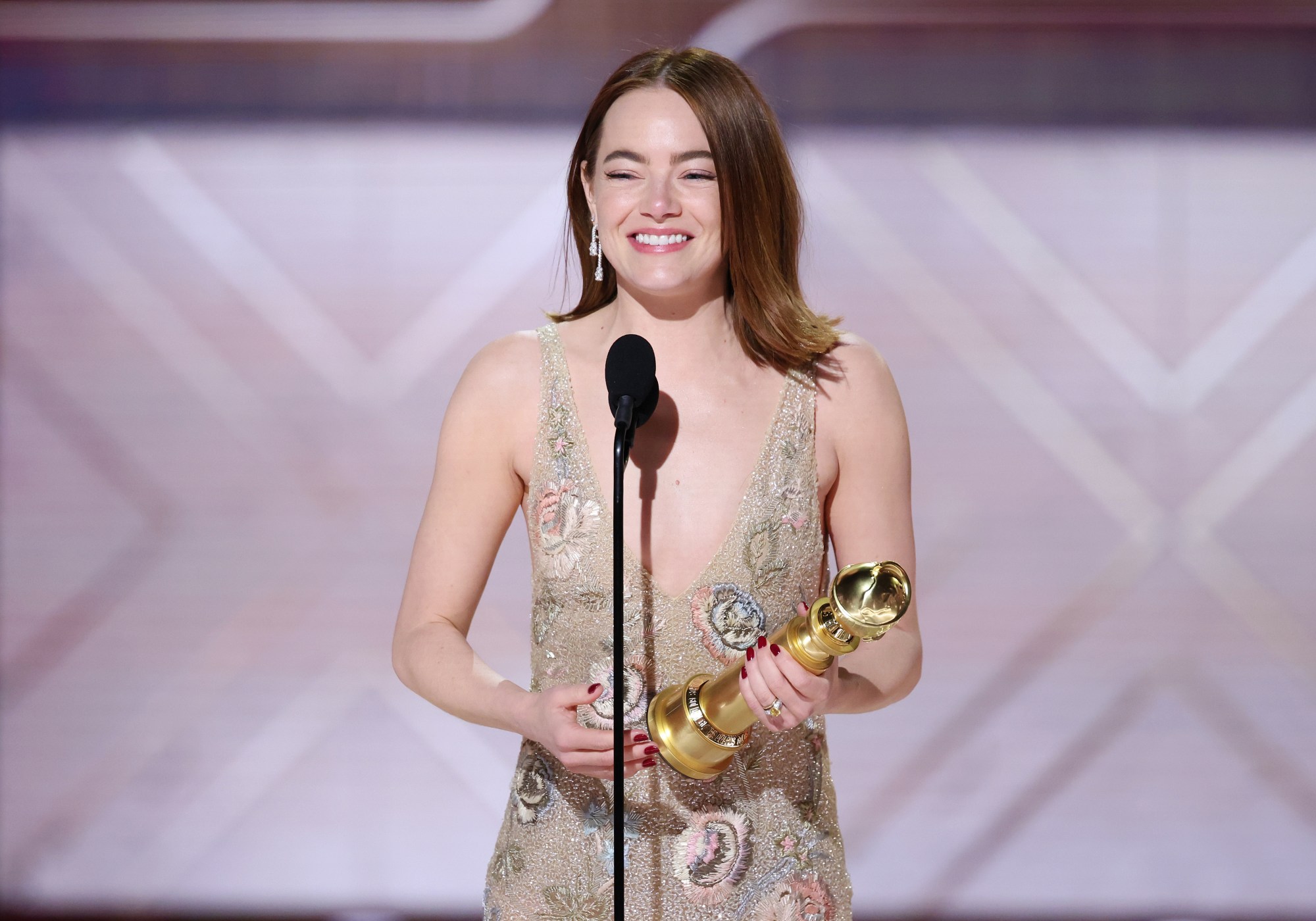 Emma Stone accepts the award for Best Performance by a Female Actor in a Motion Picture